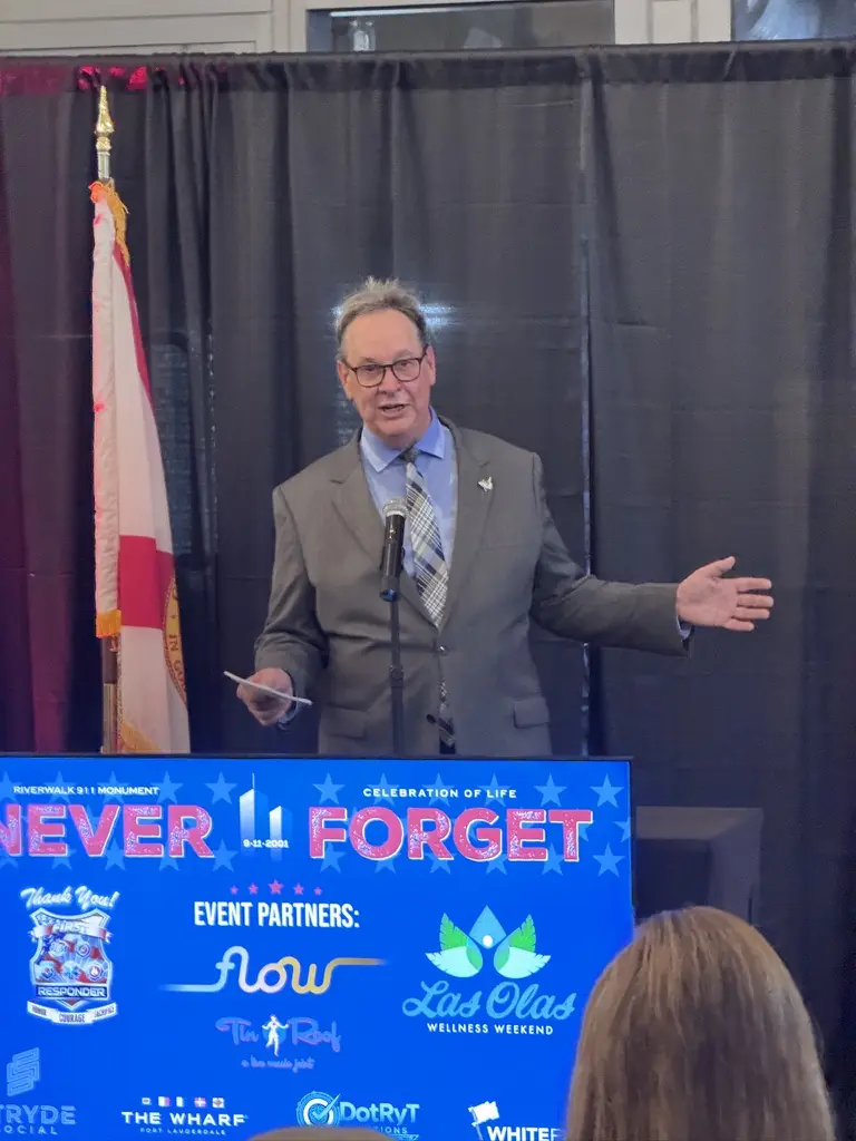 A speaker addressing the audience from the podium.